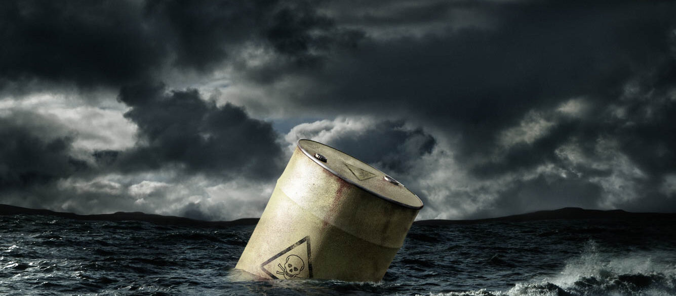 Oil barrel floating in stormy sea Oil barrel floating in stormy sea