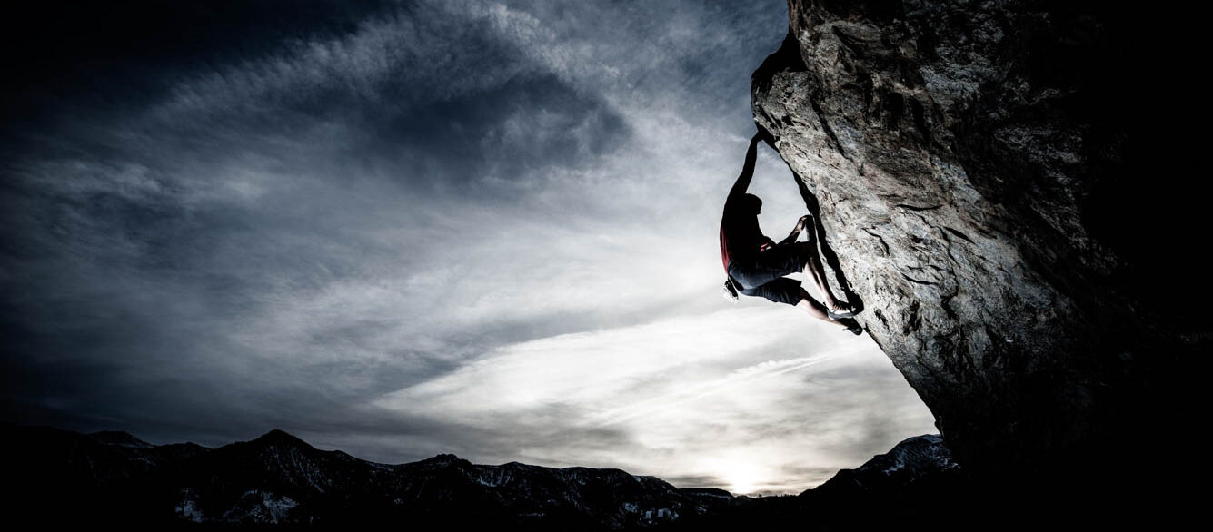 Free climbing Man free climbing rock wall