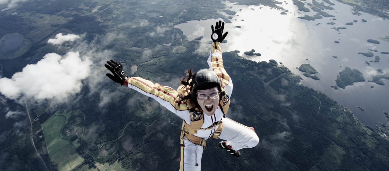 A female parachute jumper, Sweden A female parachute jumper over Sweden