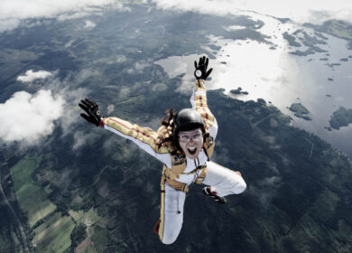 A female parachute jumper, Sweden A female parachute jumper over Sweden