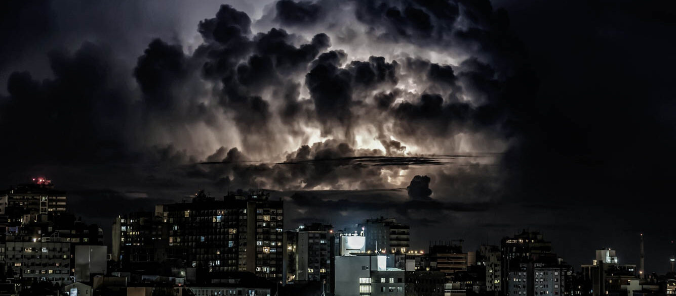 Supercell Lightning lighting up Supercell clouds over urban city area