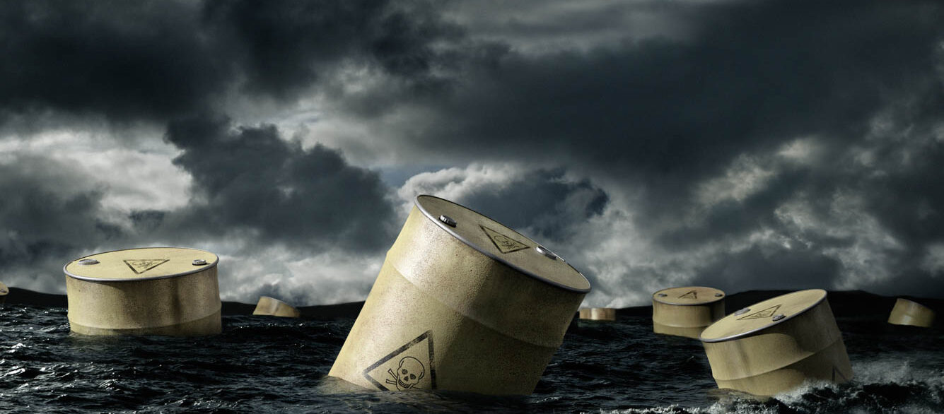 Oil barrels floating in stormy sea Oil barrels floating in stormy sea