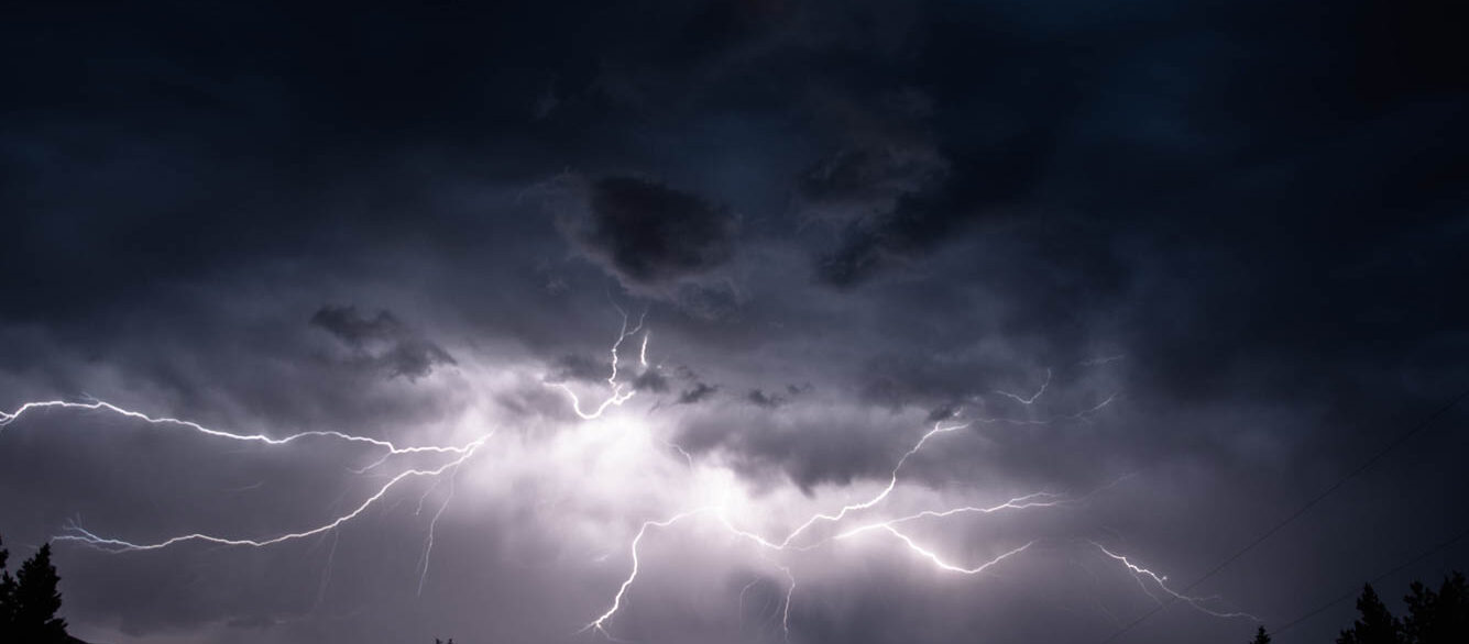 Lightning in sky over Canadian Rocky Mountains, Kootenay Region, Fernie, British Columbia, Canada Lightning in sky over Canadian Rocky Mountains, Kootenay Region, Fernie, British Columbia, Canada