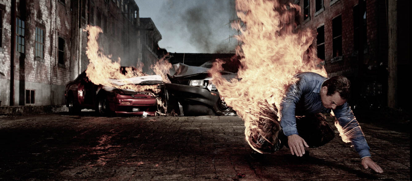 Man on fire hurtling away from auto collision Man on fire hurtling away from auto collision