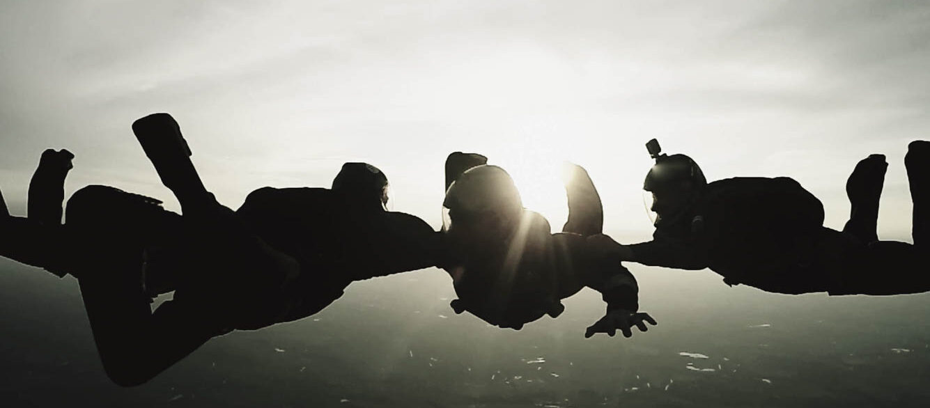 4-person skydiving team free falling 4-person skydiving team free falling