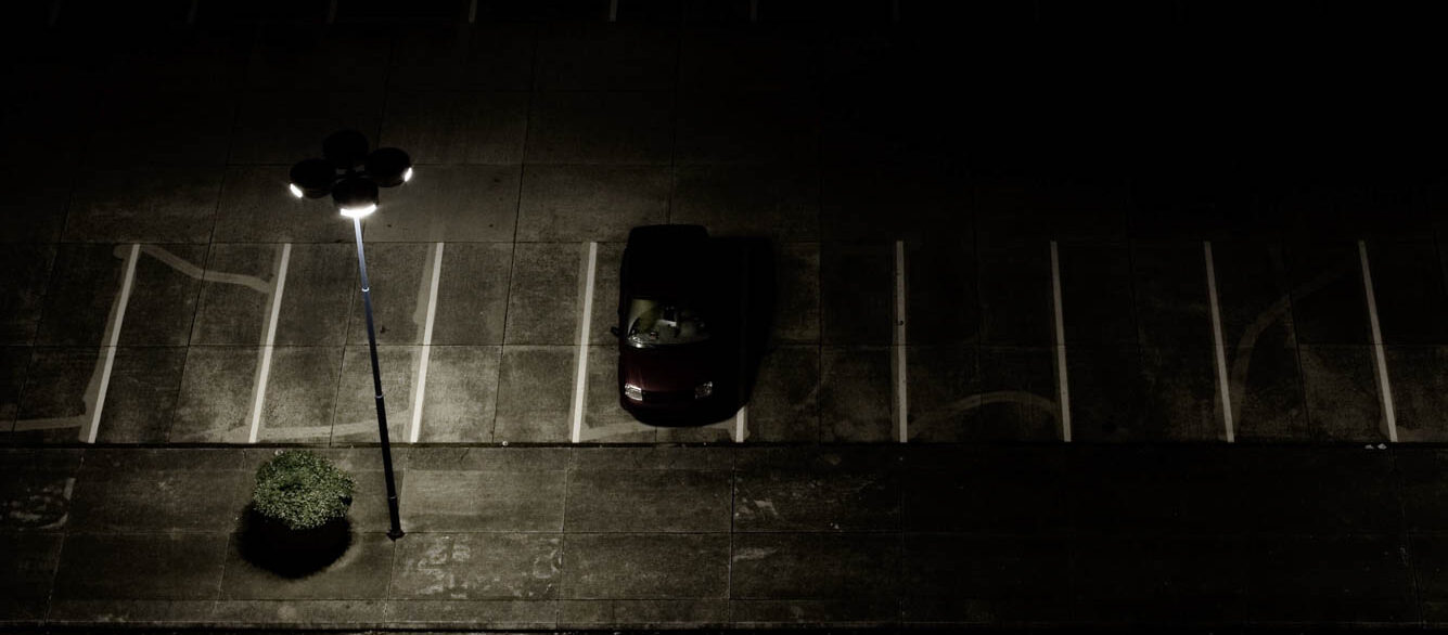 Near-empty parking lot at night