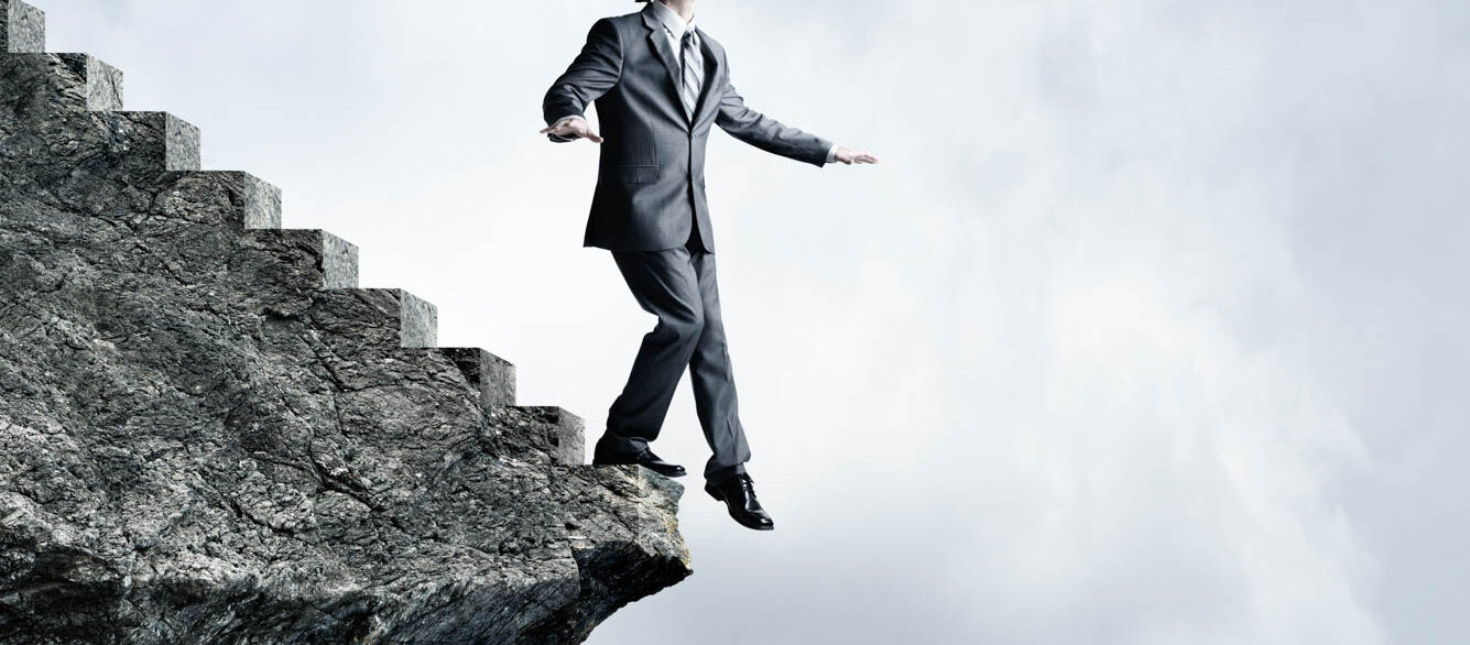 Blindfolded Businessman About To Step Off Stairs Blindfolded Businessman About To Step Off Stairs