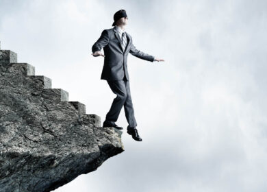 Blindfolded Businessman About To Step Off Stairs Blindfolded Businessman About To Step Off Stairs