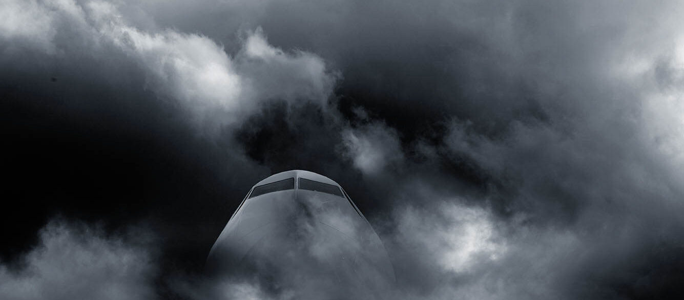 Airplane in stormy weather Airplanes cockpit seen through dark clouds and stormy weather