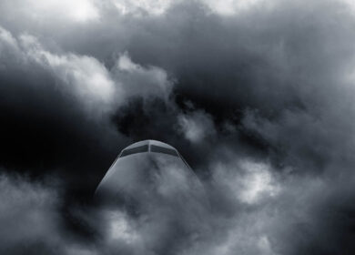 Airplane in stormy weather Airplanes cockpit seen through dark clouds and stormy weather