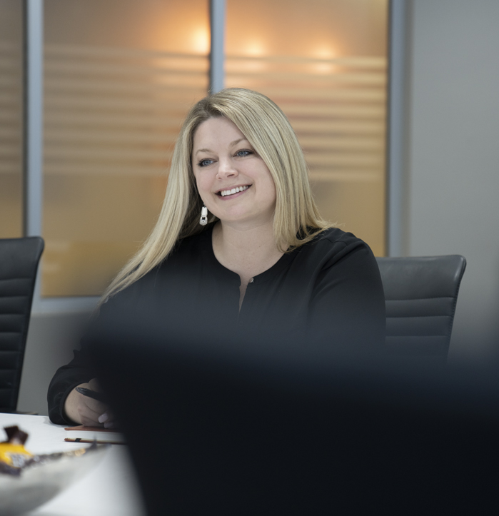 Jessica Brandt smiling in client meeting Jessica Brandt smiling in client meeting