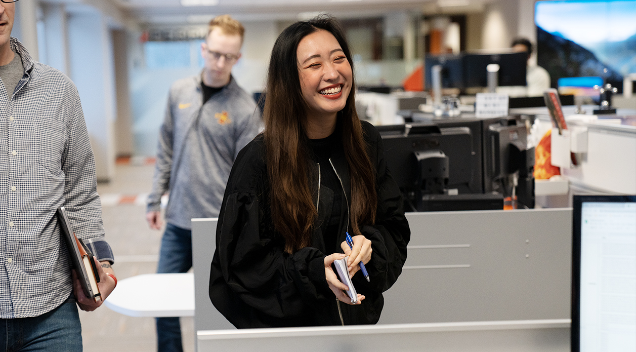 Joyce Lee laughing with coworkers Joyce Lee laughing with coworkers