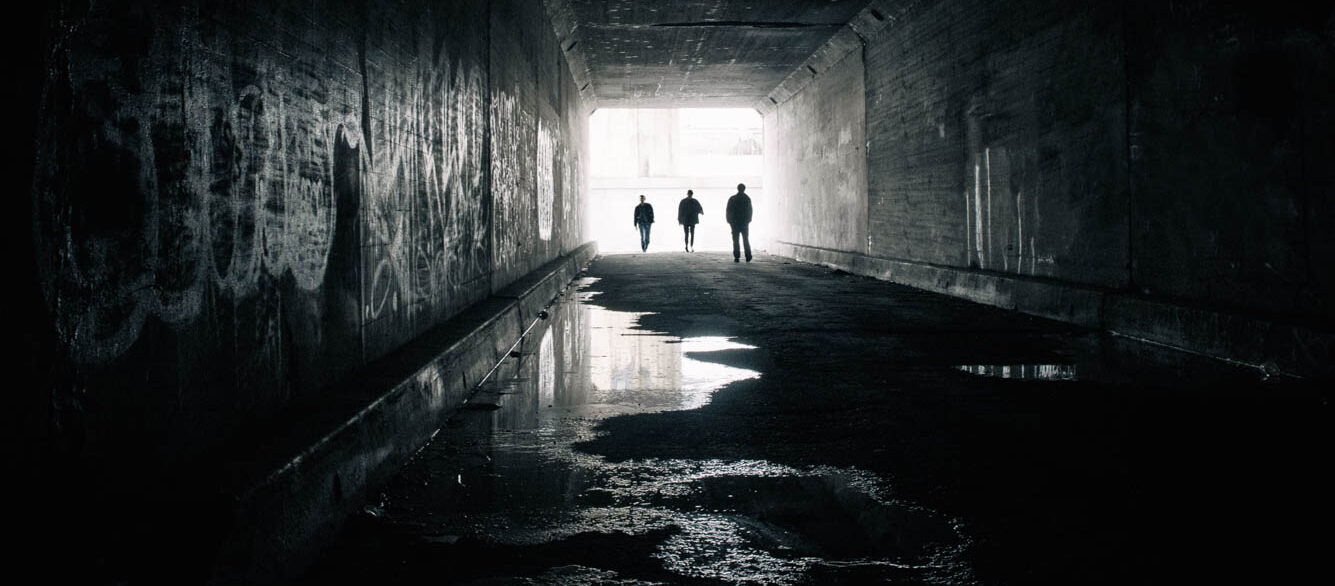 Silhouettes of three people in Sixth Street Tunnel, Los angeles, California, America, USA