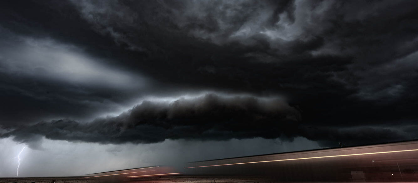 Thunderstorm, lightning and passing trucks with motion blur. New Mexico, USA